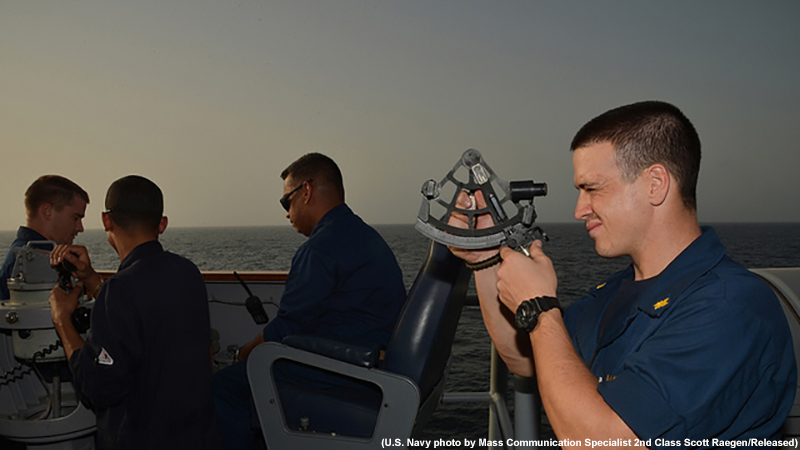 Navy photo of Ensign Jeff Bland using a sextant, GULF OF ADEN (Sept. 21, 2012)