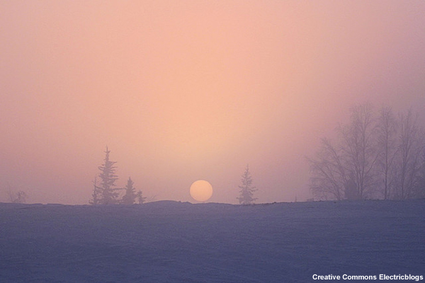 Photo of sunrise through ice fog