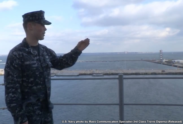 photo of aerographer's mate making visibility observation aboard the USS Kearsarge