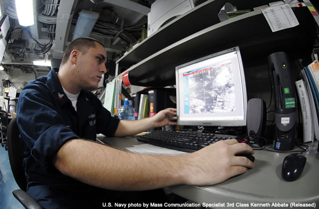 photo of Aerographers Mate 2nd Class on a six-month carrier deployment in the Western Pacific