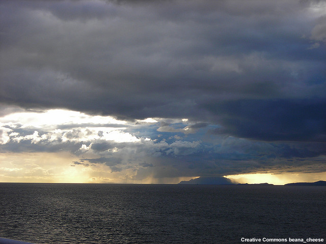 rain in distance over the ocean